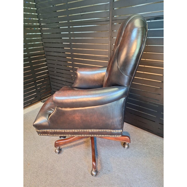 This is a very high quality Hooker Furniture Attributed. leather executive chair. It is about as flawless as it could...
