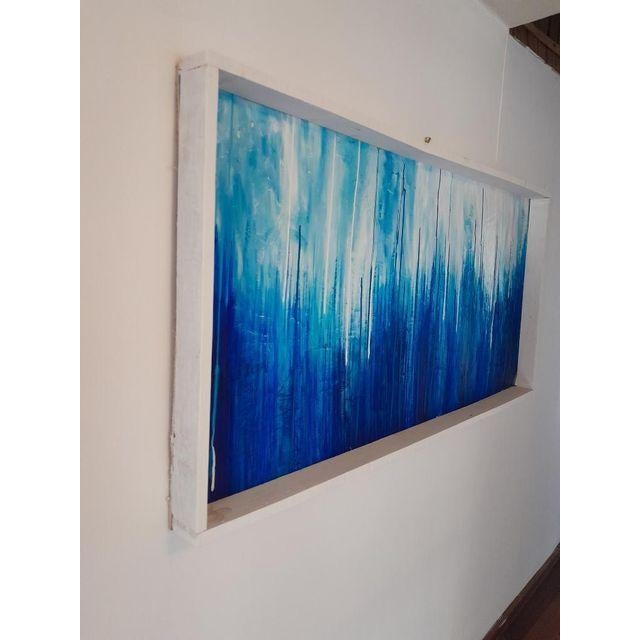 “Mood” (2020s) by RacquelJ is a striking contemporary abstract rendered in acrylic on plywood. Vertical drips of indigo,...