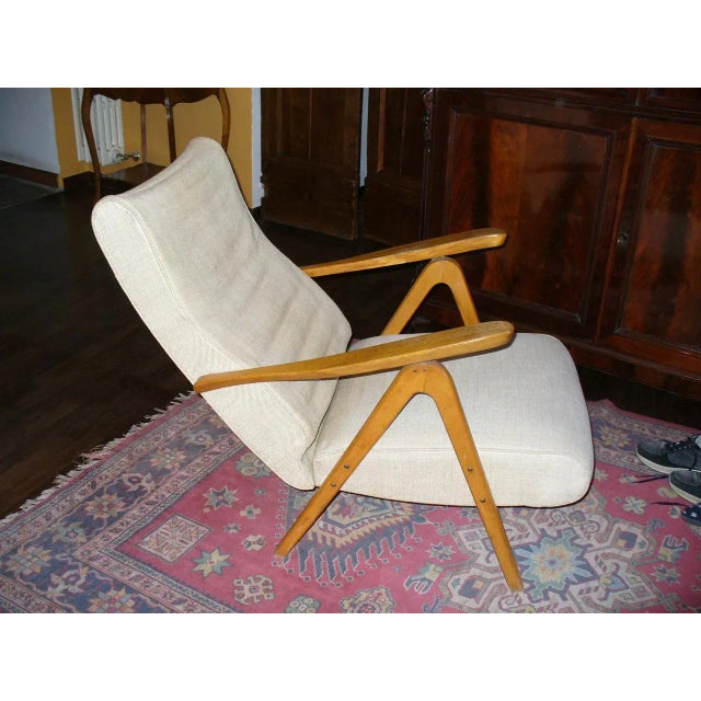 This armchair is attributed to Gianfranco Frattini for Cassina. No mark. No label. The padding of the seat should be...