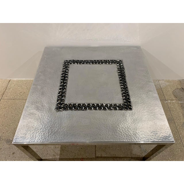 A handmade hammered and burnished aluminum coffee table by Belgian artist , Willy Luyckx for Aluclair. Willy Luyckx was a...