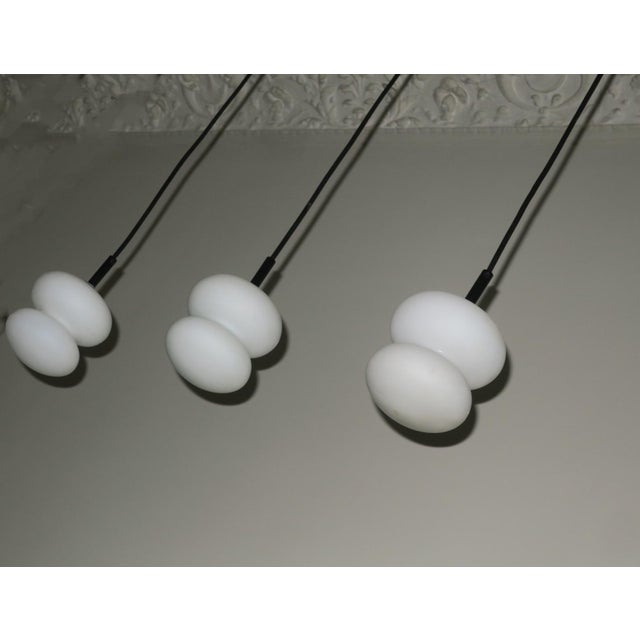 Set of 3 mid century organically shaped opal / milk glass pendant lights dating from the 1960s. New wiring. Up to 250V...