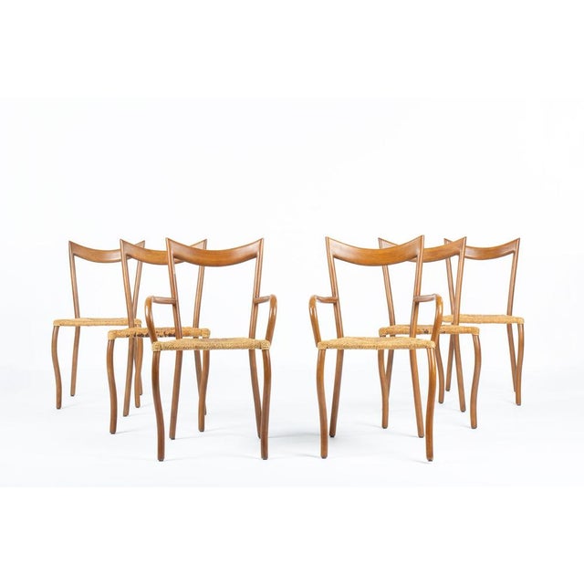 This elegant set of six chairs corresponds to the “Manila” model designed by Val Padilla and produced by Jasper Conran...