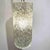 An Orrefors designed modernist crystal lantern. Textured crystal with patinated brass details.