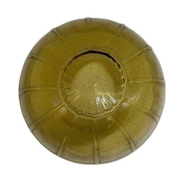 Mid-century Mediterranean style yellow hand-blown amber glass globe features an Acorn shape with a cross pattern along the...