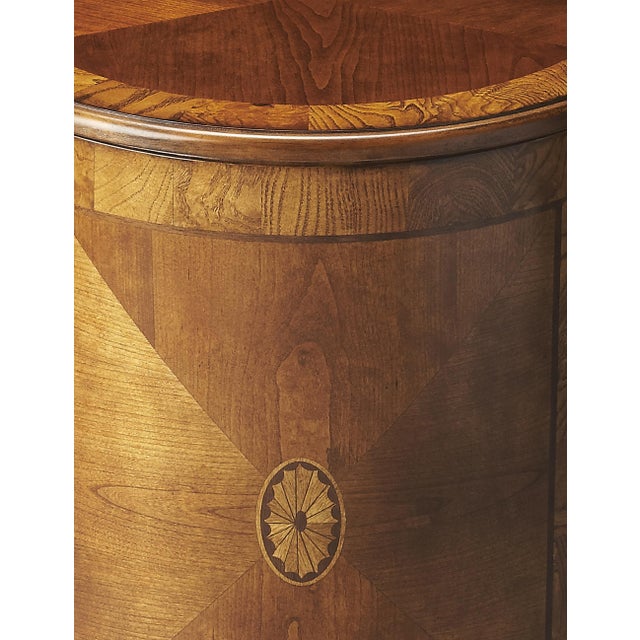 This beauty of this classic drum table is in its simplicity. The matched cherry veneer top and door with a maple and...