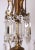 Ten-arm chandelier made of gilded bronze with crystal trimmings. The chandelier is hot-gilded. A very representative...