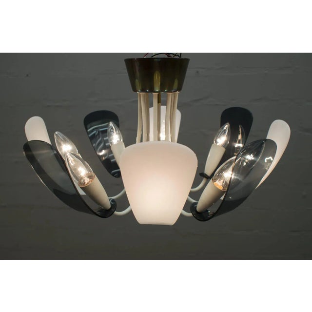 - Midcentury 8-armed brass Italian Sputnik lamp - In the manner of Arteluce - Rare and elegant midcentury design from the...