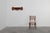 A striking Belgian Art Deco wall-mounted coat rack from the 1920s, crafted in solid oak with polished copper hooks shaped...