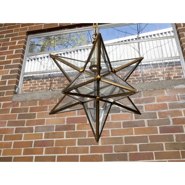 A French Midcentury star light fixture with glass panels surrounding a central socket, rewired for the USA. This French...