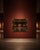 Ornate decorative wall mirror featuring a black frame with antique gold detailing and carved-style scrollwork. The piece...