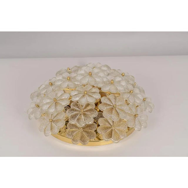 Mid-century flush mount light or wall sconce with 24 murano glass flowers over a polished brass base, made by ernst palme...