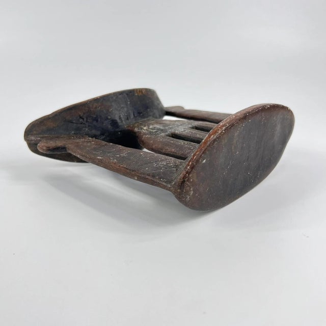 Ethiopian headrests come in various forms. They range from simple to elaborately carved artifacts. They have abstract...