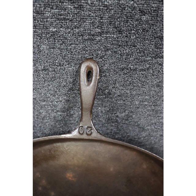 Antique cast iron skillet attributed to the Kentucky State Penitentiary in Eddyville, Kentucky. The skillet features a...
