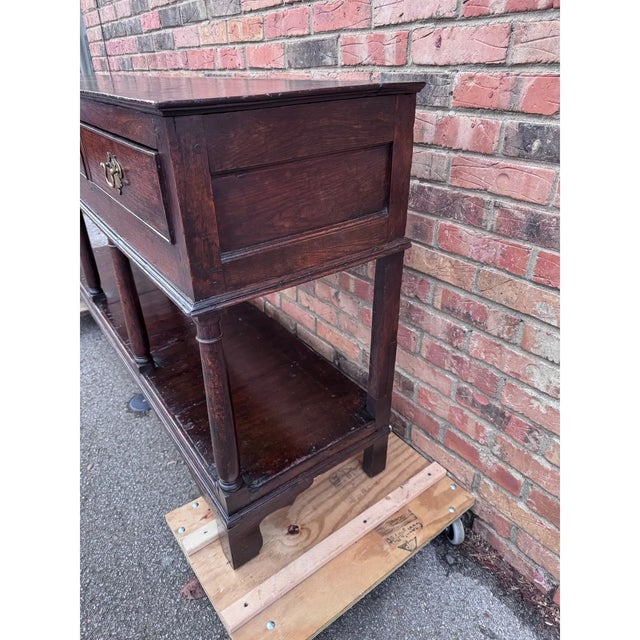 Own a piece of history with this early 19th Century English Welsh Dresser Base with Pot board. Crafted with timeless...