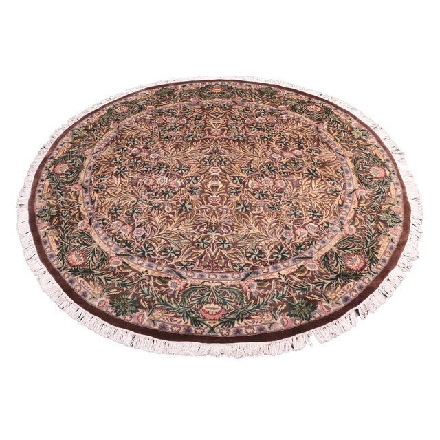 This hand‑knotted Pak Persian round rug showcases the finest expression of traditional Persian artistry. Each piece is...