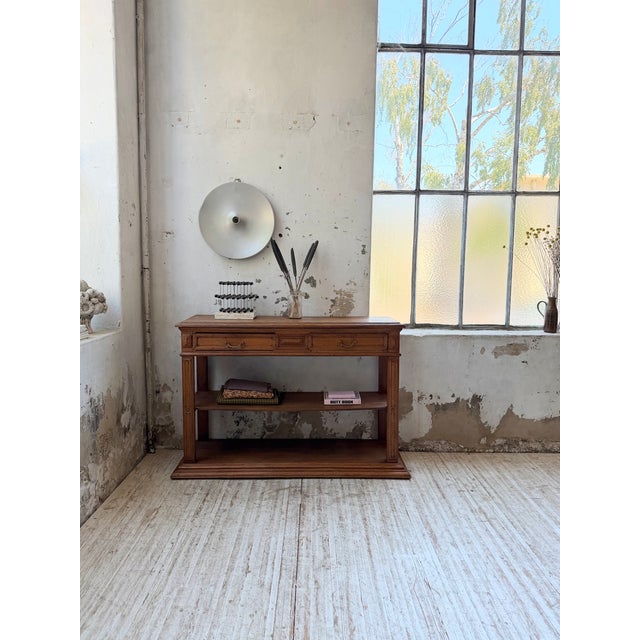 Antique solid oak console or small draper's table dating from the 1890s. we love its compact size and limited depth. its...