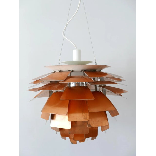 A 20th century iconic light design: ph 'artichoke' chandelier / pendant lamp. This masterpiece is designed by poul...