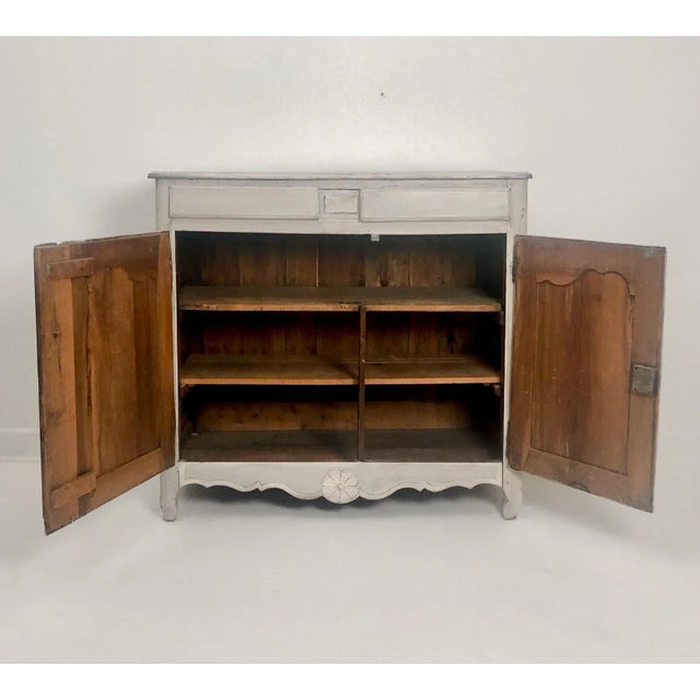 An early 19th Century Italian buffet, cabinet, 2 drawers over a cabinet, paint later.