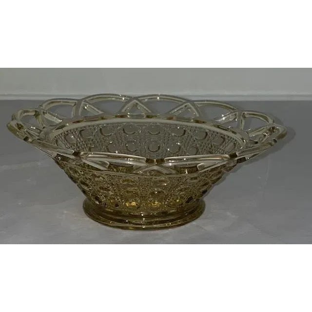 This little bowl has a wonderful open lace edge and an interesting button and cane pattern. An EAPG vintage depression...
