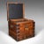 This is an antique fitted silver chest. An English, oak and bound iron shipping trunk, dating to the late Victorian...