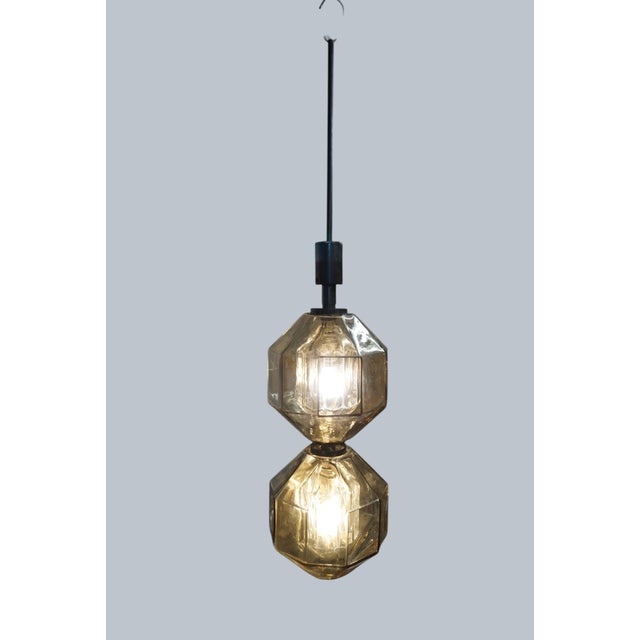 Vinicio Vianello for Vistosi, Italy, circa 1957. A rare, sculptural pendant lamp with a polyhedral body made of hand-blown...