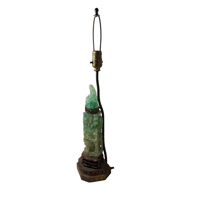 An unusual antique Chinese carved quartz figure later converted into a table lamp, most likely during the 1930s. The pale...