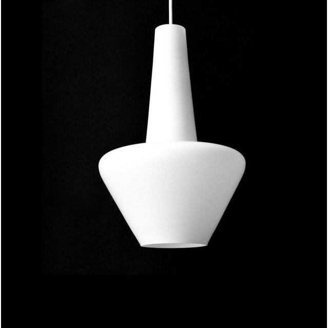Stilnovo era white pendant light. The is made from satined white glass and a white plastic ceiling cap. The lamp takes one...