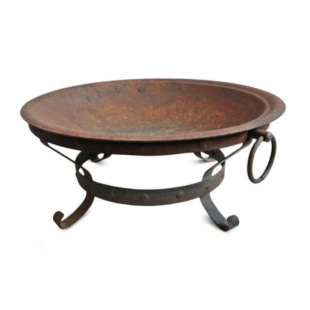 Vintage cast iron fire bowl on stand. Ring handles on sides and scroll feet base. Aged rustic patina with lots of...