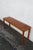 This gorgeous Console Table is made out of wood, teak wood, and veneer. The Table labeled interform collection made in...