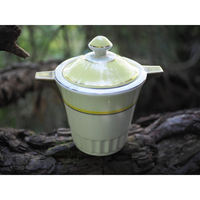 French Art deco gold and yellow sugar pot, wing shaped handles. Very classy and aesthetic, this sugar pot will find in a...