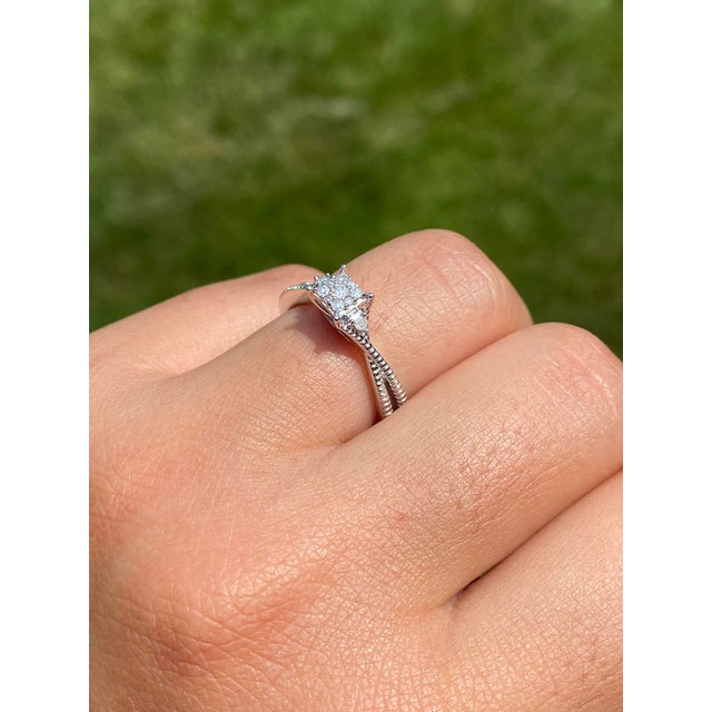 The Gladstone Place Duo: White Gold Promise Ring set with Natural Diamonds. This contemporary ring features a central...