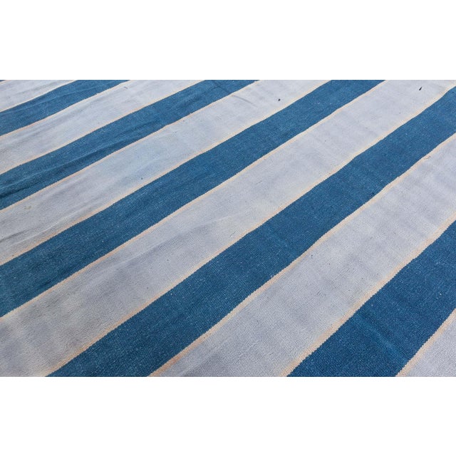 Vintage Indian Dhurrie striped rug Size: 11'1" × 14'0" (337 × 426 cm) This striking vintage Indian Dhurrie rug showcases a...