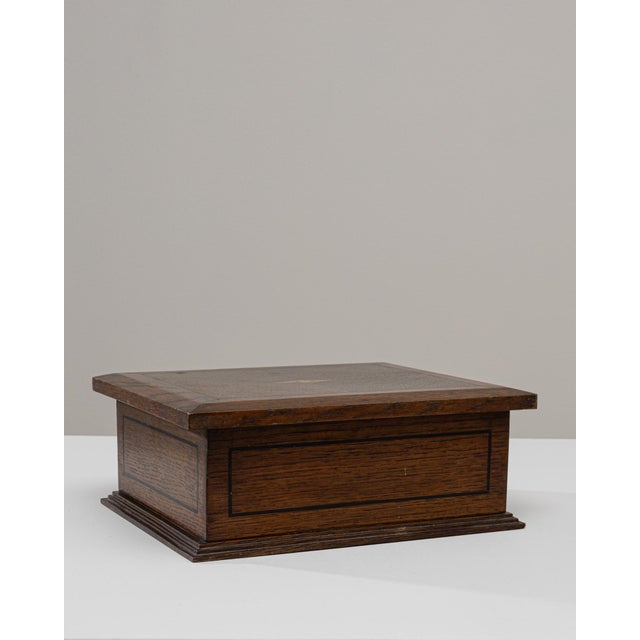 This 1920s French wooden box is crafted with clean, architectural lines that highlight the beauty of its quarter-sawn oak...