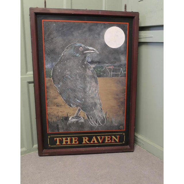 Wooden Iron Framed Hanging Pub Sign. The Raven, Signed This is an original large and heavy piece dating from the beginning...