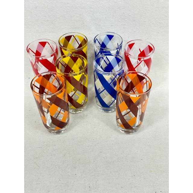 Eight vintage Mid-Century stripped glasses, two of each color. This is a pre-owned item so please see all pictures and ask...