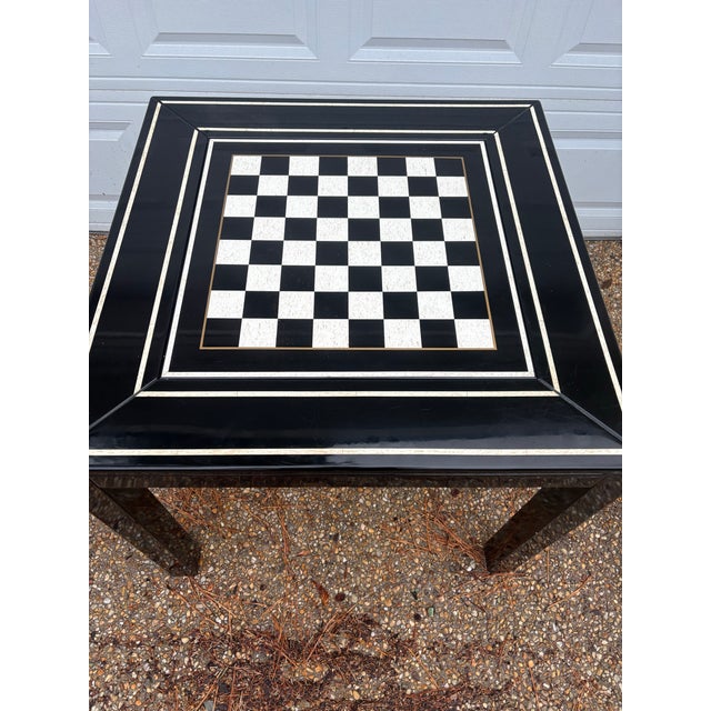 Absolutely charming vintage mid to late twentieth century black lacquered game table with chess/checkers board and...
