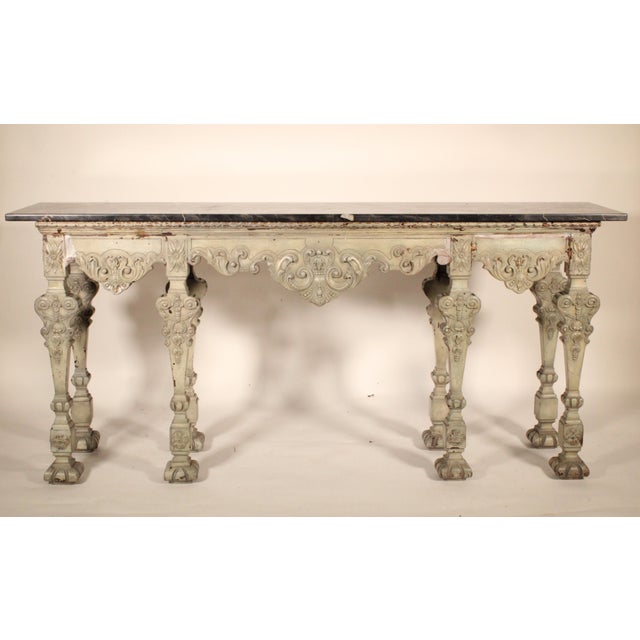 Louis XIV style grisaille painted console table with a Belgium marble top, circa 1920's. With a rectangular Belgium marble...