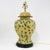 A vibrant and expressive pair of ceramic table lamps featuring a playful spotted pattern in lime green and chocolate brown...