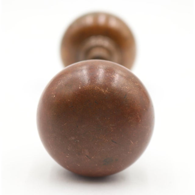 Vintage Classic dark patina brass plain round passage door knobs. Priced as a pair of knobs with a spindle. Good condition...