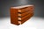 Attractive long low Danish modern sleek smooth face teak 8 drawer long low dresser by Vinde Mobelfabrik. This is a very...