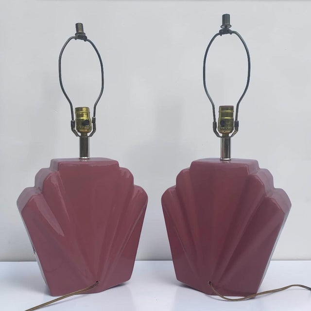 Fabulous pair of 80s deco scalloped table lamps. These lamps are gloss ceramic in a lovely mauve rose color. 23.5H 11W 5D
