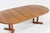 Vintage Danish round extendable dining table from the 1960s made of solid teak wood. This Danish dining table can be...