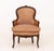 Louis XV Silk Upholstered Walnut Children's Bergere, the frame carved with floral motifs. 26.5" H x 19" W x 15" D; seat:...