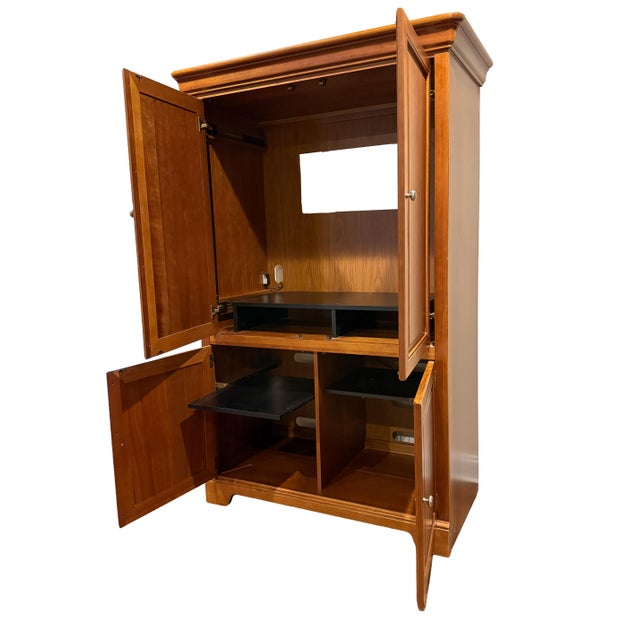 This substantial Stanley Furniture entertainment armoire offers versatile, high-quality storage and media functionality in...