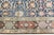 An early 20th century antique Persian Tabriz rug, the midnight blue field with a palmette, rosette, flowering vine trellis...