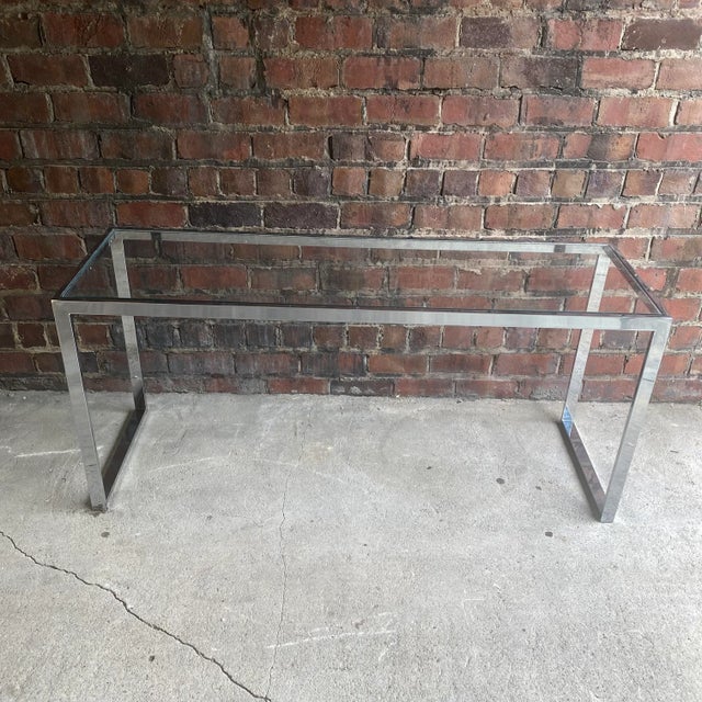 Unmarked glass and flat bar chrome console table