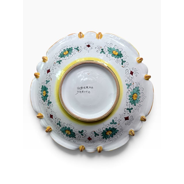 A spectacular hand-painted Italian maiolica centerpiece bowl by Sberna of Deruta, measuring an impressive 14 inches in...
