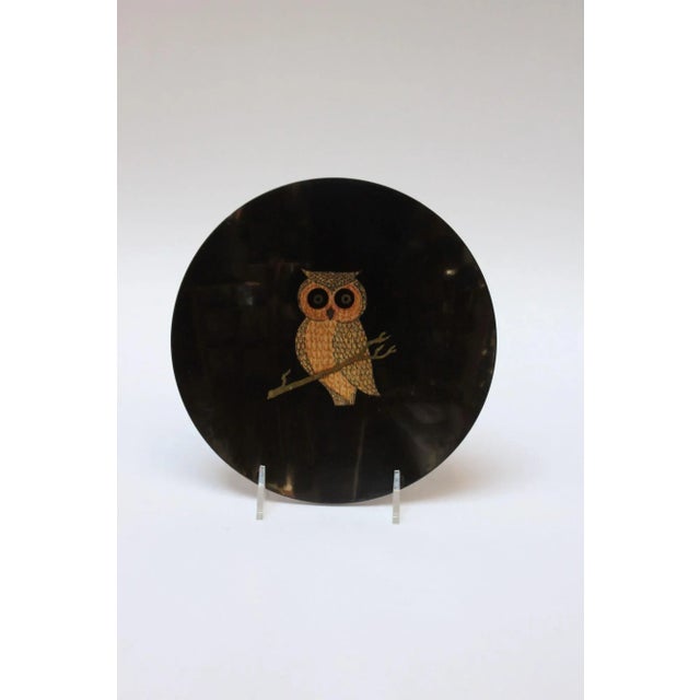 Round decorative dish/hors d'oeuvre plate/ashtray by Couroc of Monterey, California with an inlaid owl motif (circa...