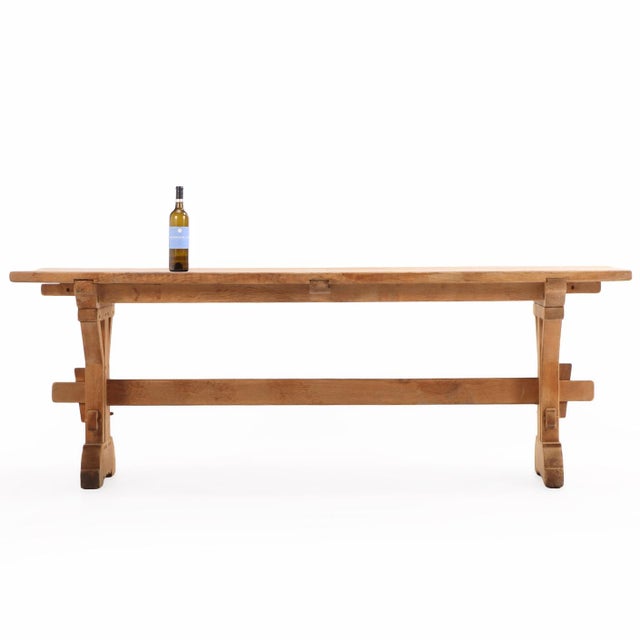 This French Brutalist-style architectural oak table dates to circa 1960 and has a strong, sculptural presence. The thick...