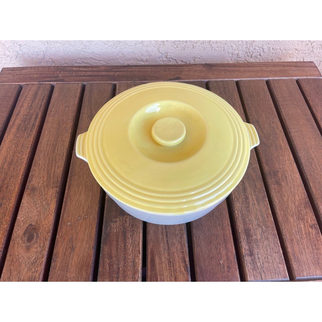 This vintage item is a Hall Ovenware refrigerator casserole dish, part of a line of ceramic storage ware made exclusively...